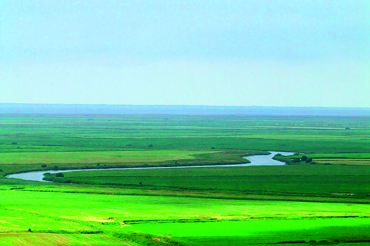 Figur A.2. Eksempel på terrænkategori I, Hede: Søer eller områder uden væsentlig vegetation og uden forhindringer. Ruhedslængde z0 = 0,01 m. 
